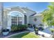 Charming home exterior with manicured landscaping, beautiful plants, and a decorative window at 11700 Leda Ln, New Port Richey, FL 34654