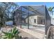 A screened-in pool area provides a private oasis for swimming and lounging in the backyard of the home at 11700 Leda Ln, New Port Richey, FL 34654