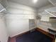 Walk-in closet featuring a wire shelving system for optimal organization and storage, and a blue rug on hardwood flooring at 12027 Hoosier Ct # 104, Hudson, FL 34667