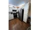 A functional kitchen with stainless steel appliances and abundant white cabinets at 12027 Hoosier Ct # 104, Hudson, FL 34667