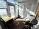 A sunroom featuring a door to the outside, and a bright, airy feel with ample sunlight at 12027 Hoosier Ct # 104, Hudson, FL 34667