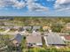 An aerial view of the neighborhood showcasing the residential homes, lawns, and landscaping at 13032 Pinnacle Ln, Hudson, FL 34669