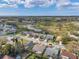 Aerial view of a residential neighborhood with single-Gathering homes and a green landscape at 13032 Pinnacle Ln, Hudson, FL 34669