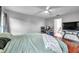 Spacious primary bedroom boasts hardwood floors, with an ensuite bathroom at 13032 Pinnacle Ln, Hudson, FL 34669
