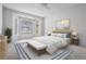 Serene bedroom features a large window for natural light, a neutral color palette, and ample space at 1320 Wolford Dr, Trinity, FL 34655