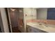 Cozy bathroom featuring a single sink, vanity, and ample cabinet space at 1414 Grand Blvd, Holiday, FL 34690