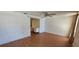 Bedroom featuring hardwood floors, a ceiling fan, and view of a built-in desk at 1414 Grand Blvd, Holiday, FL 34690