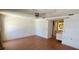 Bedroom with hardwood floors, ceiling fan, and glimpse of attached bathroom at 1414 Grand Blvd, Holiday, FL 34690