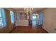 A spacious living room with wood floors and a chandelier at 1414 Grand Blvd, Holiday, FL 34690
