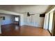 Living room with wood floors and view of the backyard at 1414 Grand Blvd, Holiday, FL 34690