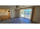 Living room with sliding glass doors leading to the pool area at 1414 Grand Blvd, Holiday, FL 34690
