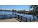 Relaxing water view from a wooden deck, highlighting waterfront living at 1414 Grand Blvd, Holiday, FL 34690