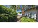 Landscaped yard featuring various plants and ground cover at 1414 Grand Blvd, Holiday, FL 34690