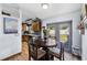 Cozy dining area adjacent to the kitchen with wood-look floors and backyard access at 16265 Pointview Rd, Brooksville, FL 34601