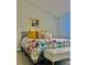 Bright bedroom with a floral-patterned bedspread and a window with natural light at 2843 Thaxton Dr # 34, Palm Harbor, FL 34684