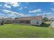 Well-maintained backyard with a screened-in patio and ample green space, great for recreation and relaxation at 3606 Dow Ln, Spring Hill, FL 34609