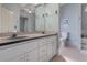 Bathroom featuring a double sink vanity, with a separate toilet and bathtub area at 3606 Dow Ln, Spring Hill, FL 34609