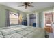 Comfortable bedroom with a closet, and a window allowing natural light to fill the space at 3606 Dow Ln, Spring Hill, FL 34609