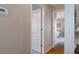 Hallway view showcasing the natural light and access to other rooms in the home at 3606 Dow Ln, Spring Hill, FL 34609