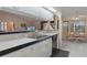 Open concept kitchen with a breakfast bar and view into the breakfast nook at 3606 Dow Ln, Spring Hill, FL 34609