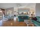 Spacious living room featuring hardwood floors, a ceiling fan, and an open design concept at 3606 Dow Ln, Spring Hill, FL 34609