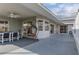 Spacious covered patio with ample seating and sleek flooring, ideal for entertaining and relaxing at 3606 Dow Ln, Spring Hill, FL 34609