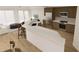 Expansive kitchen with center island, stainless steel appliances, and natural light at 5015 Us Highway 19 # 106, New Port Richey, FL 34652