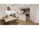 Bright eat-in kitchen with stainless steel appliances, white countertops, and seating for six at 5015 Us Highway 19 # 106, New Port Richey, FL 34652