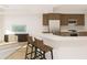 Modern kitchen featuring stainless appliances and a large island with seating at 5015 Us Highway 19 # 106, New Port Richey, FL 34652