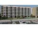 Aqua Harbor view of a condo building overlooking the marina with a community pool and tennis court at 5015 Us Highway 19 # 201, New Port Richey, FL 34652