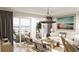 Bright living room with modern furnishings, beachy art, and a view of the marina at 5015 Us Highway 19 # 201, New Port Richey, FL 34652