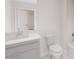 Bathroom featuring gray vanity with solid surface countertops, toilet, and shower/tub combo at 5015 Us Highway 19 # 307, New Port Richey, FL 34652