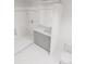 A modern, all-white bathroom with a glass-enclosed shower, sleek vanity, and contemporary fixtures creating a spa-like feel at 5015 Us Highway 19 # 405, New Port Richey, FL 34652
