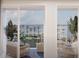 Balcony view overlooking the harbor with outdoor seating and tropical plants at 5015 Us Highway 19 # 605, New Port Richey, FL 34652