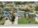 Aerial view of the property showcasing the well-maintained lawn, above-ground pool, and surrounding neighborhood at 5139 Jenson Ave, Spring Hill, FL 34608