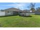 Expansive backyard featuring lush green lawn, above-ground pool, and a storage shed for outdoor convenience at 5139 Jenson Ave, Spring Hill, FL 34608