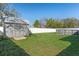 Large backyard with green grass, storage shed, and above-ground pool, perfect for outdoor enjoyment at 5139 Jenson Ave, Spring Hill, FL 34608