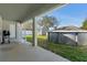 Backyard with a covered patio, shed and above ground pool at 5139 Jenson Ave, Spring Hill, FL 34608
