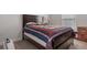 Bedroom with a large bed and neutral carpet at 5139 Jenson Ave, Spring Hill, FL 34608