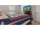 Bright bedroom with a television and dresser at 5139 Jenson Ave, Spring Hill, FL 34608