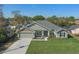Beautiful home with well-manicured lawn, neutral paint, and a two-car garage and long driveway at 5139 Jenson Ave, Spring Hill, FL 34608