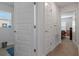 Hallway with white doors leading to bedrooms at 5139 Jenson Ave, Spring Hill, FL 34608