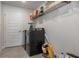 Laundry room with shelving and appliances at 5139 Jenson Ave, Spring Hill, FL 34608