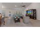 Comfortable living room features neutral carpet, ceiling fan, and vaulted ceiling at 5139 Jenson Ave, Spring Hill, FL 34608