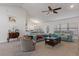 Bright living room with vaulted ceilings, neutral carpet, and open concept layout at 5139 Jenson Ave, Spring Hill, FL 34608