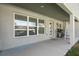 Covered patio featuring neutral colors, bright sunlight and a grill for outdoor cooking and entertaining at 5139 Jenson Ave, Spring Hill, FL 34608