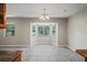 Dining area with a chandelier and a bay window overlooking the front yard provides natural light at 5345 Carlton Rd, New Port Richey, FL 34652