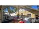 Inviting screened porch with a charming outdoor table and chairs, perfect for relaxing at 5748 Massachusetts Ave, New Port Richey, FL 34652