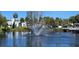 Scenic lake view with a fountain and lakeside amenities for community enjoyment at 5800 Massachusetts Ave, New Port Richey, FL 34652