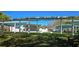 Park featuring a stage area with covered pavilions, perfect for community events at 5800 Massachusetts Ave, New Port Richey, FL 34652